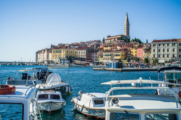 colorful houses in the old town of Rijeka with the sea and boats in the port in the foreground