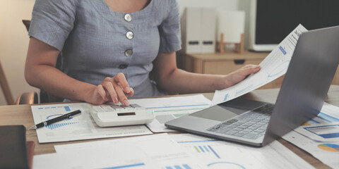 bookkeeper or financial inspector hands making report, calculating or checking balance. Home...