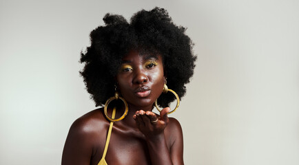 Black woman fashion model blow kiss for beauty, makeup and African empowerment in skincare and afro...
