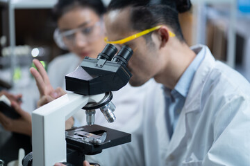 Medical Science Laboratory Looking Under Microscope Analysis of Test Biotechnology working with Advanced Equipment
