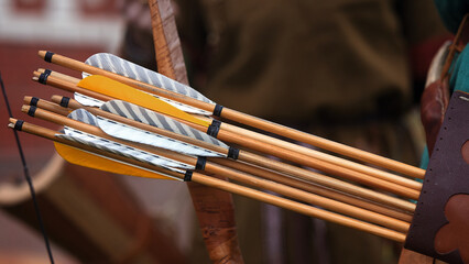 Wooden arrows for the bow. Hand crafted arrows in medieval style. Arrows with feather plumage in...
