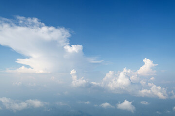 Aerial view clouds and blue sky from airplane window