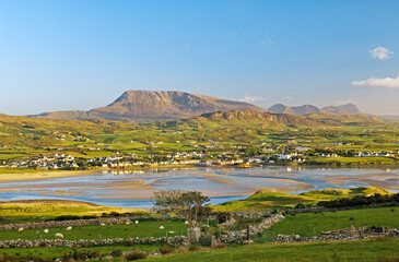 South over the village of Dunfanaghy from near Horn Head toward Muckish Mountain on north Donegal coast, Ireland. Summer evening