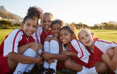 Team, soccer or happy sports girl with smile on field, grass or stadium for health, teamwork or...