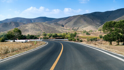 Curved asphalt road in mountains of Inner Mongolia, China