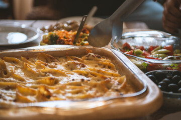 Baked vegetables served in trays, cozy homemade food.