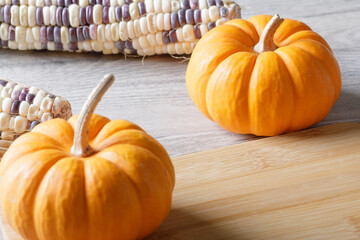 Close up of punkins for Halloween decorations on wooden background