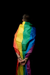Fototapeta premium Arrested 19 Year Old Teenage Boy wrapped in A Pride Flag