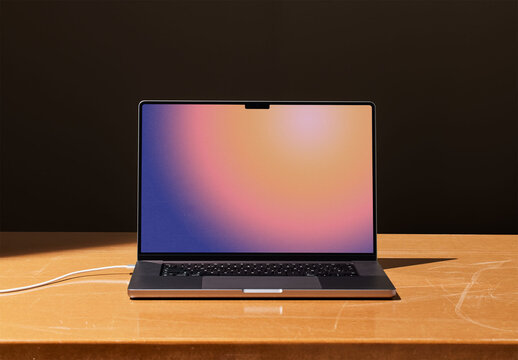 Frontal Laptop Mockup with Dark Background and Brown Table
