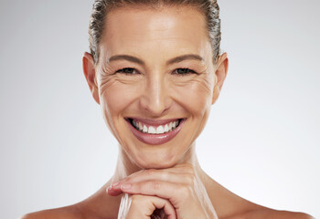 Skincare, anti aging and beautiful mature woman with a smile on her face on white background....