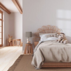 Fototapeta na wymiar Blurred background, farmhouse children bedroom. Single bed with wall mockup. Parquet floor. Boho interior design