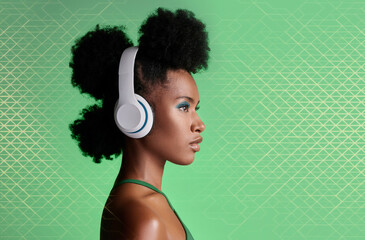 Black woman, music headphones and fashion hairstyle on studio background with green geometric patterns and makeup cosmetics. Style, trend or pride for beauty model listening to Jamaican radio podcast - obrazy, fototapety, plakaty