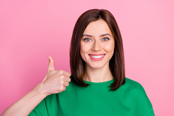 Closeup photo of young smiling attractive girl thumb up recommend new shopping ad buy online isolated on pink color background