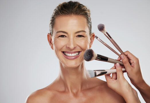 Beauty, makeup and cosmetic brush by a senior woman face with a happy smile in a studio. Portrait of a elderly person face from Paris with happiness, cosmetics brushes and healthy skin smiling