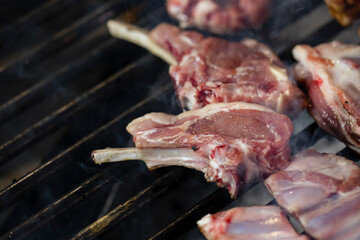 Closeup of grilling pork ribs, homemade barbecue.