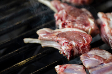 Closeup of grilling pork ribs, homemade barbecue.