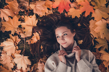Above view photo of peaceful adorable lady arms touch knitwear collar dreamy imagine free time...