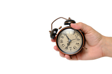 Retro alarm clock in hand on a white background.