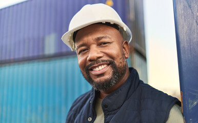 Logistics, supply chain and shipping with a black man delivery worker standing outdoor on a commercial dock. Stock, retail and cargo with a male courier working in the export or service industry