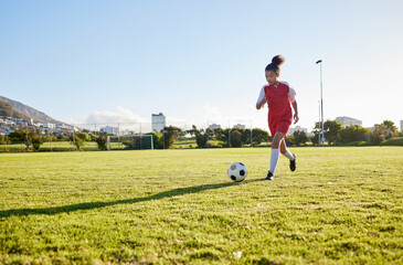 Girl running on grass field, soccer fitness to kick football and young kid training energy in Brazil. Strong healthy child, future athlete exercise for goal and play outdoor sports game happiness