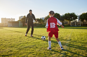 Soccer, coach and child sport on a outdoor school field with a ball for fitness and exercise....