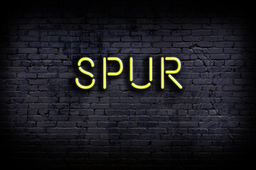 Neon sign. Word spur against brick wall. Night view © iushakovsky