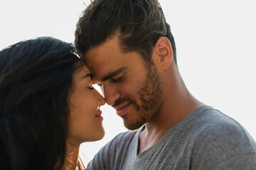 portrait of pleased bearded man and woman with closed eyes.