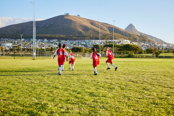 Girls, soccer team or fitness game on grass field in workout, training or exercise for game or match goals. Running, football or sports children, students or kids in energy competition at high school