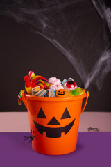 Halloween Jack o Lantern orange bucket with candy © zulfiska