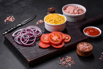 Raw ingredients for delicious Italian pasta: tomatoes, minced meat, pasta, spices and herbs