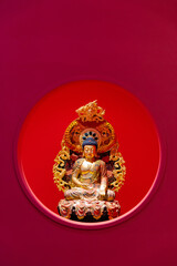 Looking at the Buddha statue through the hole