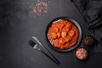 Delicious meatballs made from ground beef in a spicy tomato sauce