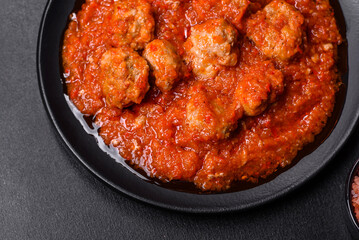 Delicious meatballs made from ground beef in a spicy tomato sauce