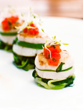 Pan-seared scallops with calypso sauce, garlic oil, and zucchini noodles. Ubud, Bali, Indonesia.
