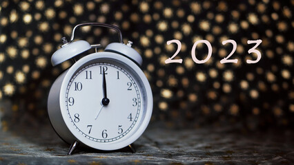 the clock chimes. the concept of the new year 2023