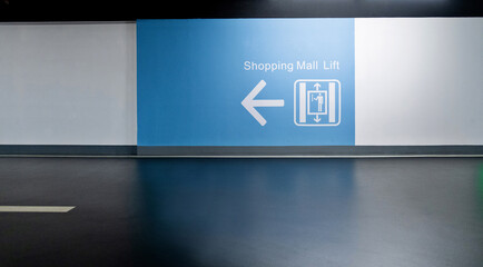 Elevator sign on the wall of mall
