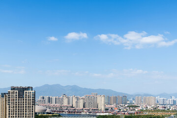 Modern city buildings under blue sky