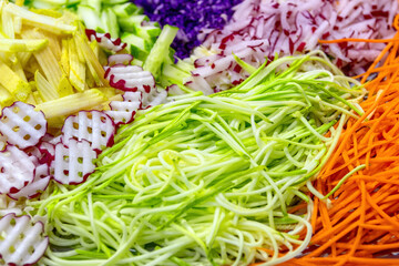 Fresh various grated vegetables as salad ingredients top view. Healthy eating concept.