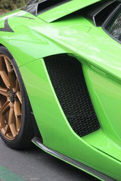 Green Sports Car With Gold Wheels