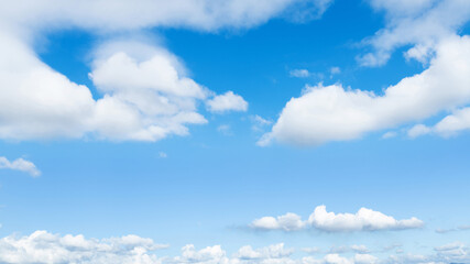 Naklejka na ściany i meble Blue sky with some white clouds