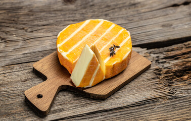 cream Round brie or camambert cheese on a wooden background. banner, menu, recipe place for text,...
