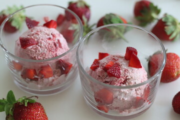 Scoops of Homemade strawberry ice cream. Three ingredient ice cream made of fresh strawberries, whipped cream and condensed milk
