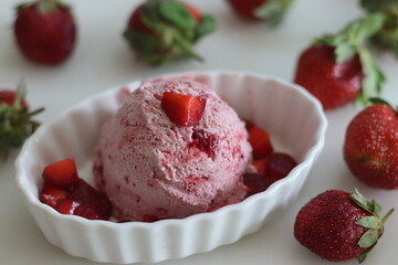 Scoops of Homemade strawberry ice cream. Three ingredient ice cream made of fresh strawberries, whipped cream and condensed milk