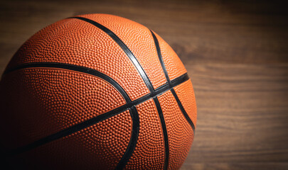 Basketball ball on the wooden table.