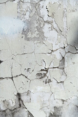 White paint peeling off from wall