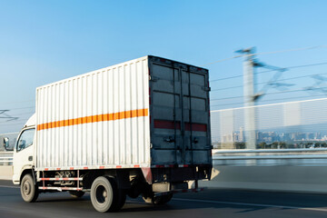 White truck driving on road