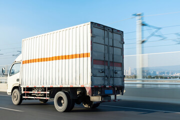 White truck driving on road
