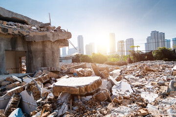 Contrast of demolished old house and modern skyscraper