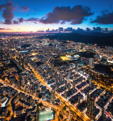 Epic night aerial view of the downtown of Kowloon, Towakwa and Hung Hom Area, Hong Kong