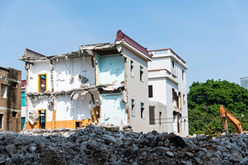 Construction machinery is demolishing the house